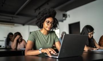 business student at the computer